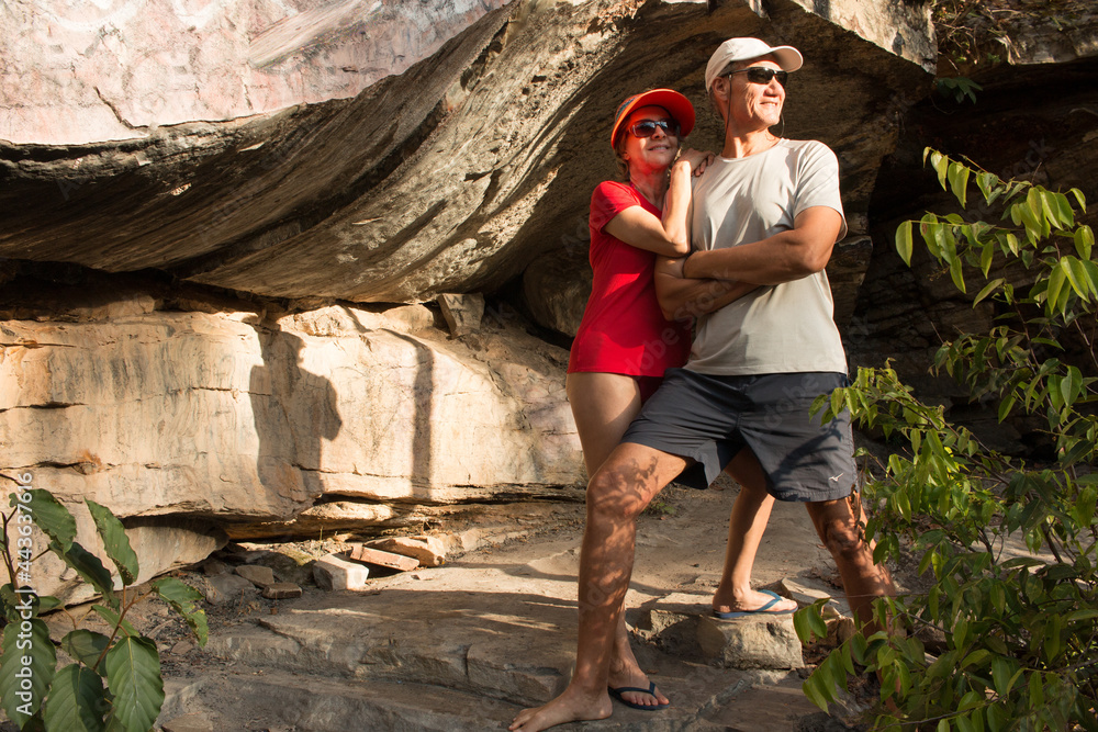 Happy Couple Posing by a Big Rock in the interior of Brazil Happy Couple Posing by a Big Rock in the interior of Brazil