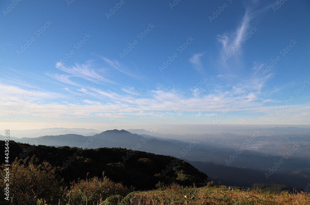 Scenery of tropical mountainous landscape with cloudy blue sky background in the morning. 