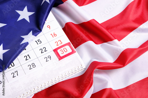 Foto Flag United States America with calendar marked on thirtieth day Memorial Day