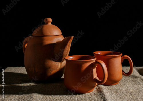 still life with a clay teapot and two cups