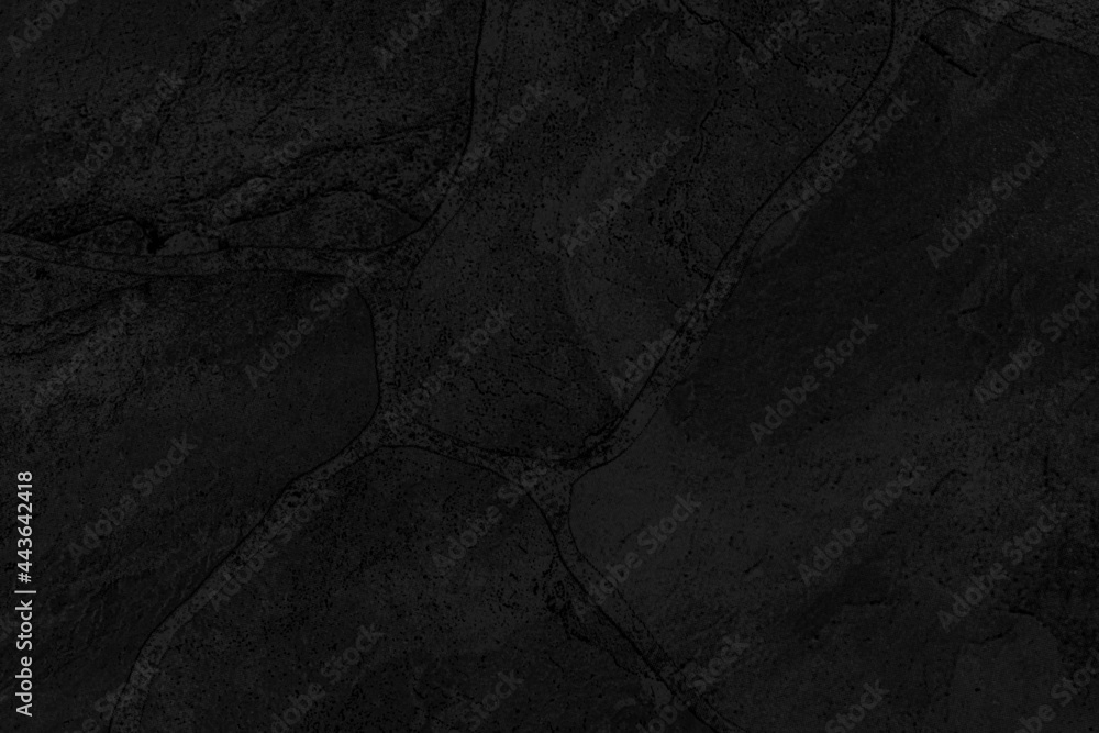 Naklejka premium Dark grey black slate background or texture. Black granite slabs background