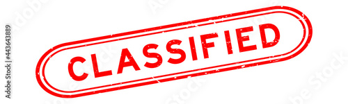 Grunge red classified word rubber seal stamp on white background