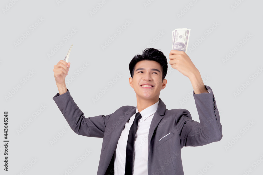 Young asian business man holding money dollar isolated on white background, businessman in suit holding banknote and success and excited with finance, savings and investment, income and spending. Young asian business man holding money dollar isolated on white background, businessman in suit holding banknote and success and excited with finance, savings and investment, income and spending.