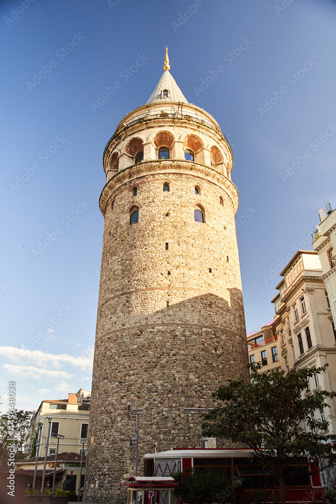 Istanbul, Turkey - May 2, 2021: View of the Galata Tower through the street.