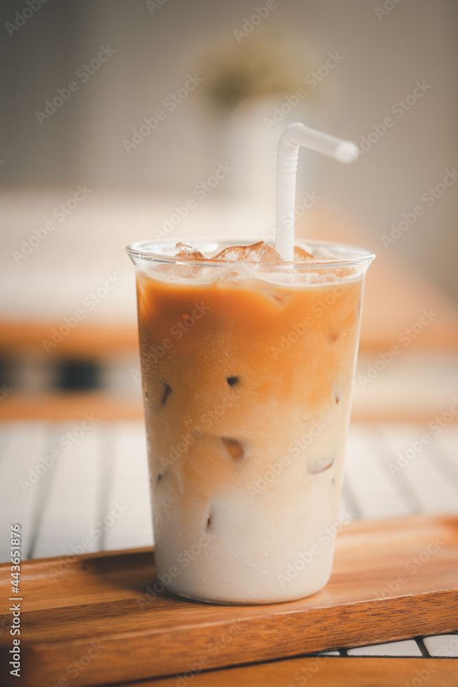 Iced latte coffee on a table inside the cafe. Iced latte coffee on a table inside the cafe.