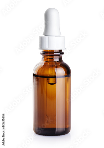 Dropper bottle with essential oil from rose isolated on white background. With clipping path.