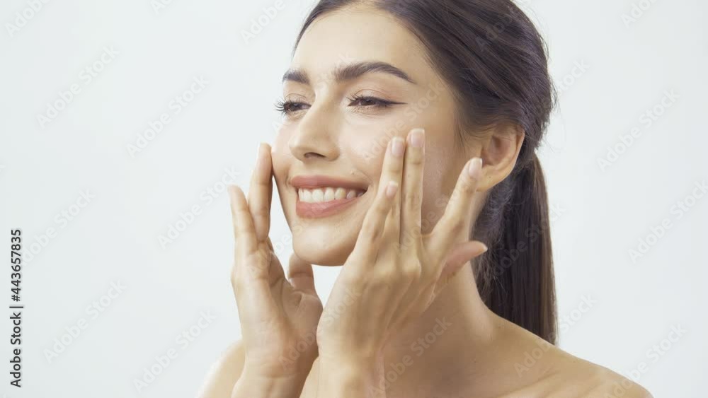 Beautiful Woman in White Background. She touching her face with smiling. Beautiful Woman in White Background. She touching her face with smiling.