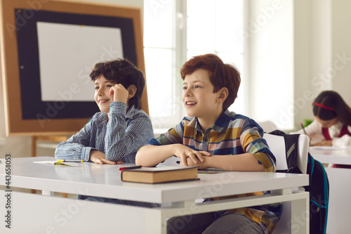 Photography Pupils studying at desks in classroom