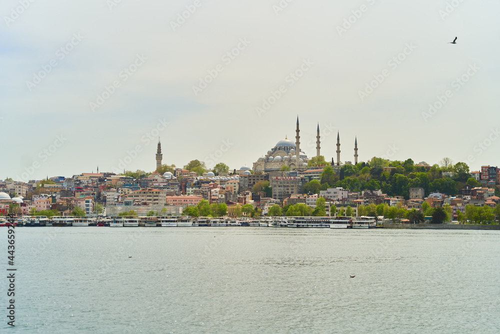 Istanbul, Turkey - May 2, 2021: View across the Bosphorus to the Suleymaniye Mosque.