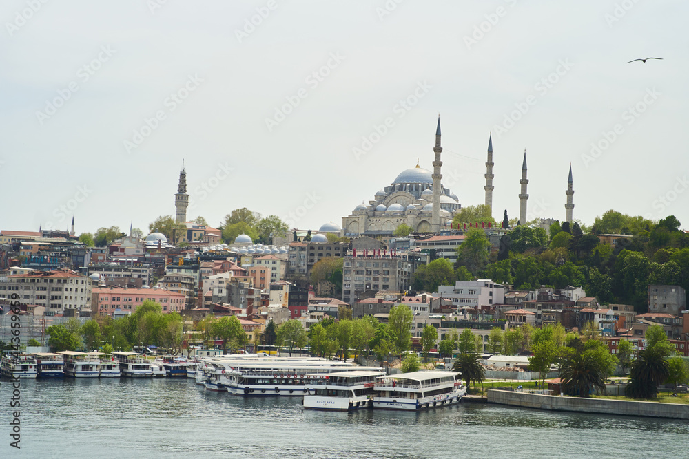 Obraz premium Istanbul, Turkey - May 2, 2021: View across the Bosphorus to the Suleymaniye Mosque.