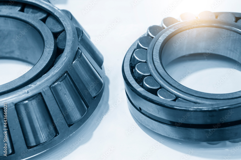 The close-up scene of taper cylindrical rolling bearing. The mechanical parts manufacturing concept. The close-up scene of taper cylindrical rolling bearing. The mechanical parts manufacturing concept.