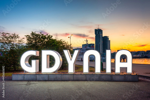 Illuminated Gdynia city inscription at sunset. Poland