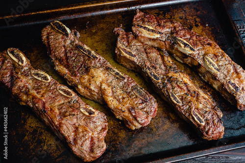 Grilled Beef Short Ribs on a Sheet Pan: Barbecue flanken beef ribs with a rustic background