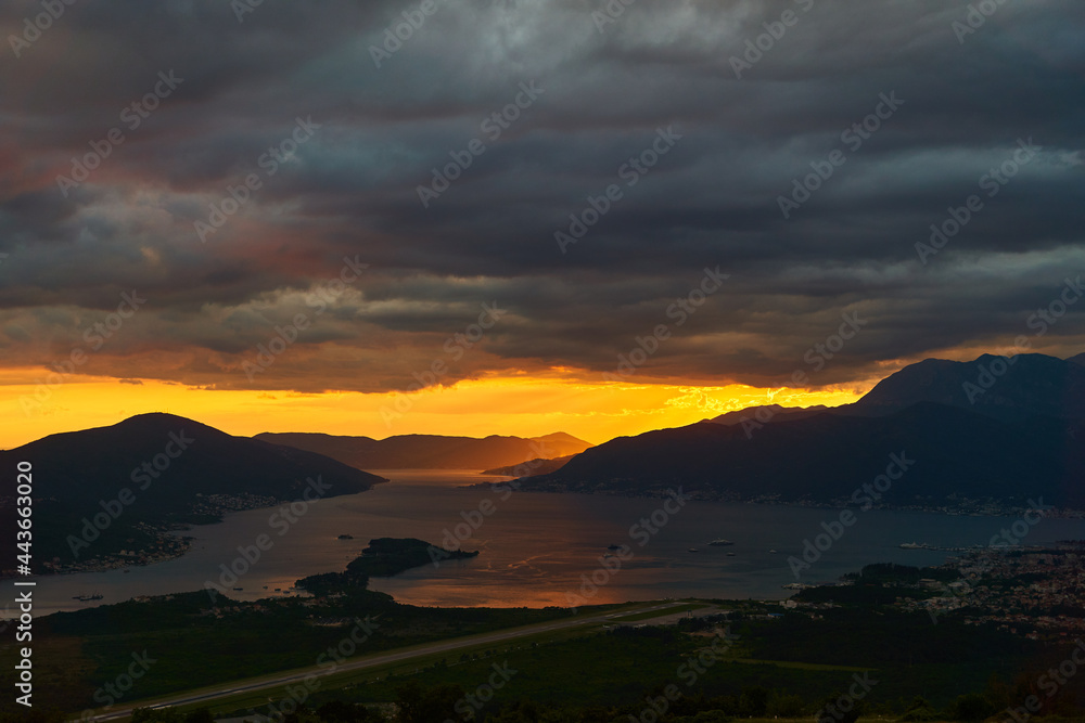 Fototapeta premium View of the Tivat Bay and the airport runway. Sunset in the Tivat Bay