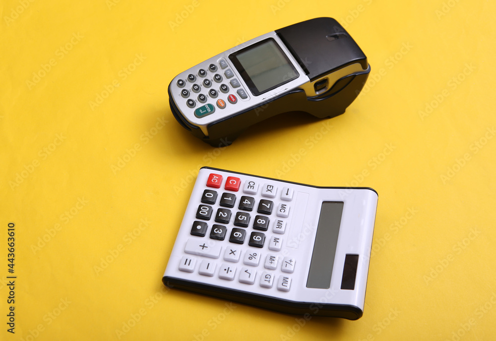 Pos terminal and calculator on yellow background. Pos terminal and calculator on yellow background.