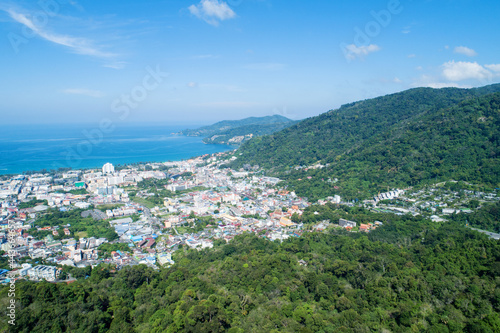 Aerial view blue ocean and blue sky with mountain in the foreground at Patong Bay of Phuket Thailand Landscape of patong city phuket in sunny summer day time Beautiful tropical sea High angle view