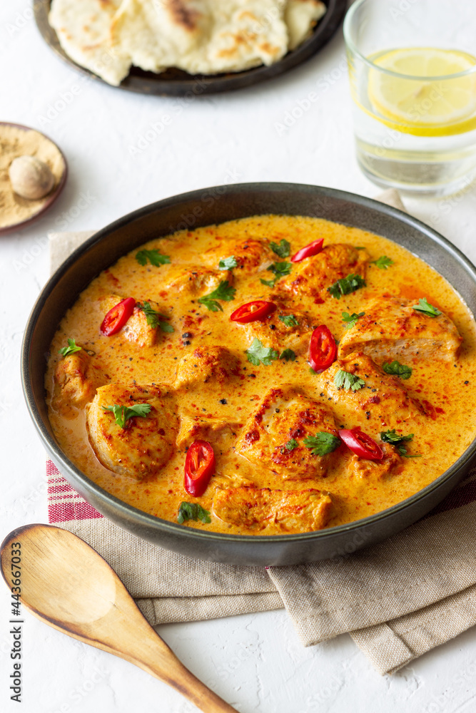 Chicken tikka masala curry with herbs and peppers. Indian food. National cuisine. Chicken tikka masala curry with herbs and peppers. Indian food. National cuisine.