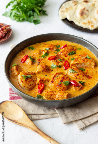 Chicken tikka masala curry with herbs and peppers. Indian food. National cuisine.