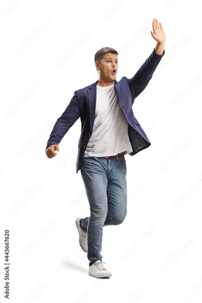 Full length shot of a man running, gesturing wait with hand and shouting Full length shot of a man running, gesturing wait with hand and shouting