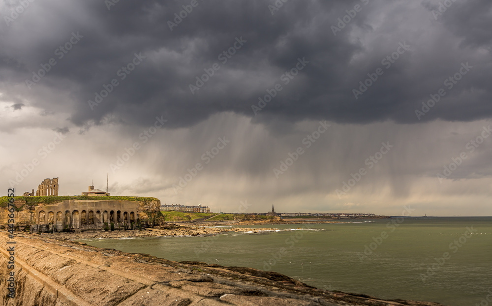 The view of Tynemouth, Cullercoats & Whitley Bay including St Mary's Lighthouse taken from Tynemouth's North Pier on a rainy day