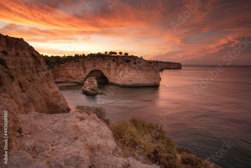 Sunrise sky over rocky cliffs of Portuguese Algarve, Praia de Vale Covo, Carvoeiro 