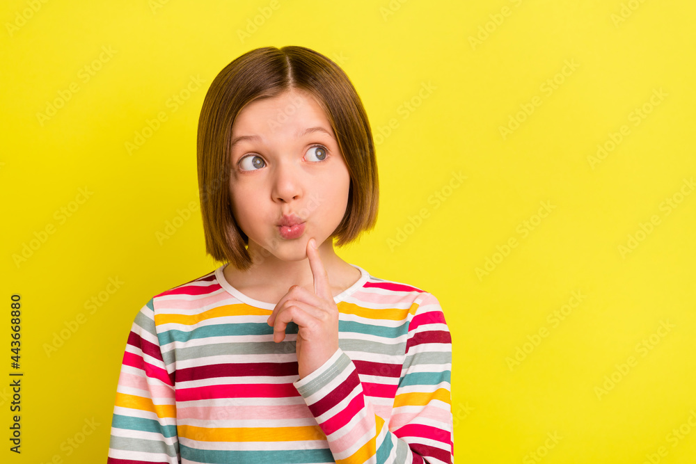 Photo of positive minded dreamy girl look empty space imagine plan isolated on yellow color background Photo of positive minded dreamy girl look empty space imagine plan isolated on yellow color background