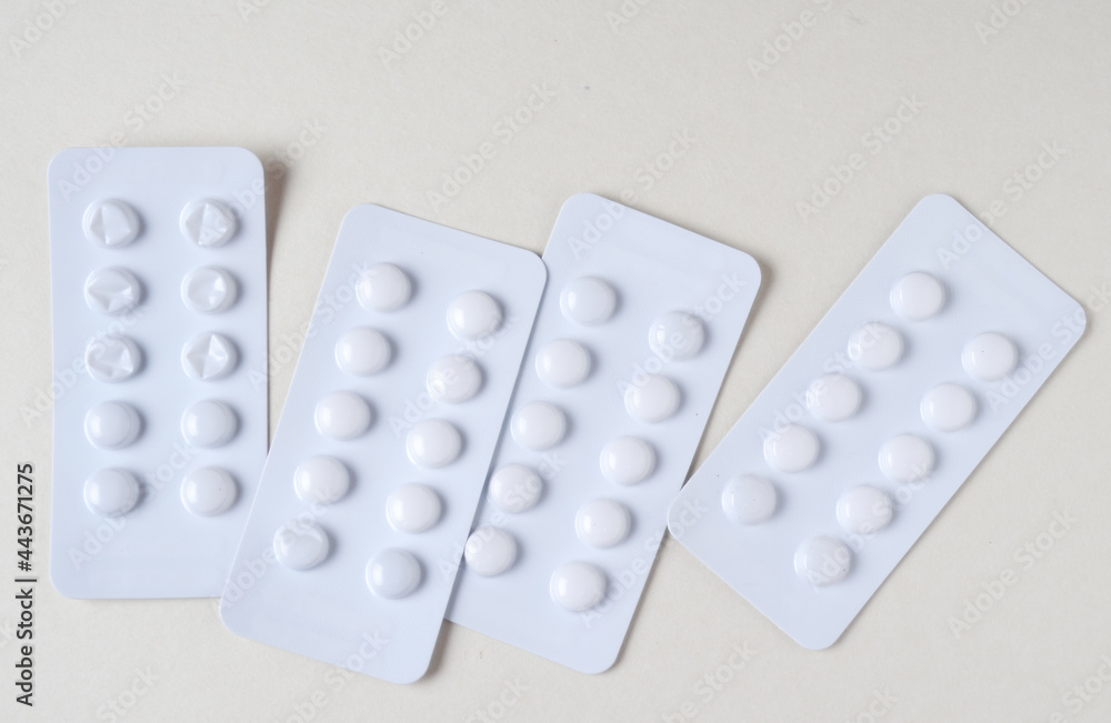 The white packs of pills on white The white packs of pills on white