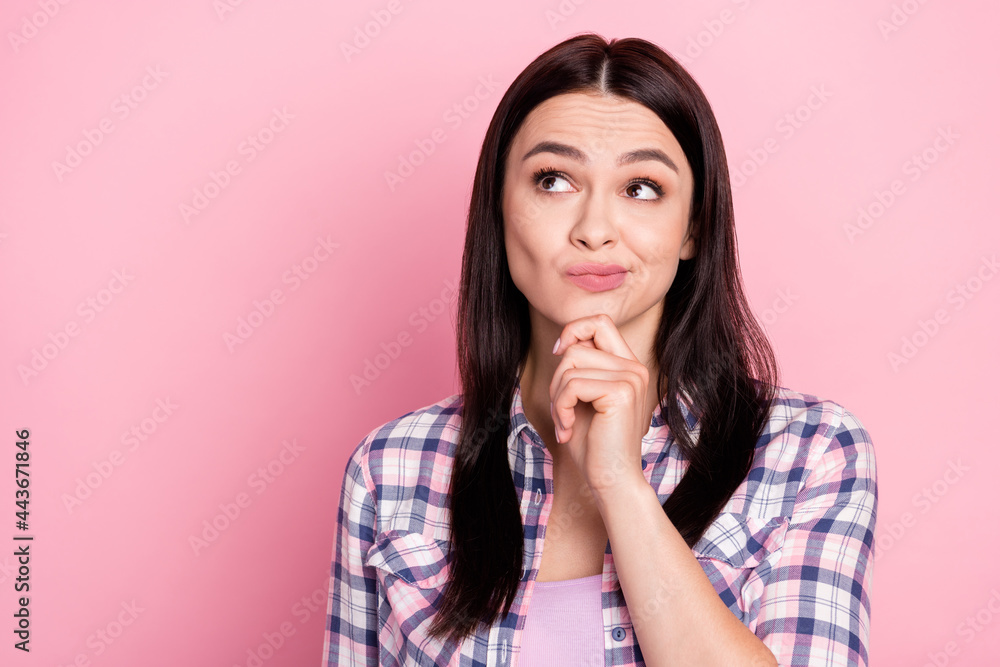 Photo portrait of unsure girl thoughtful got doubt isolated on pastel pink color background Photo portrait of unsure girl thoughtful got doubt isolated on pastel pink color background