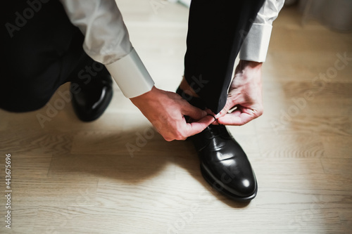 Beautiful man, groom posing and preparing for wedding