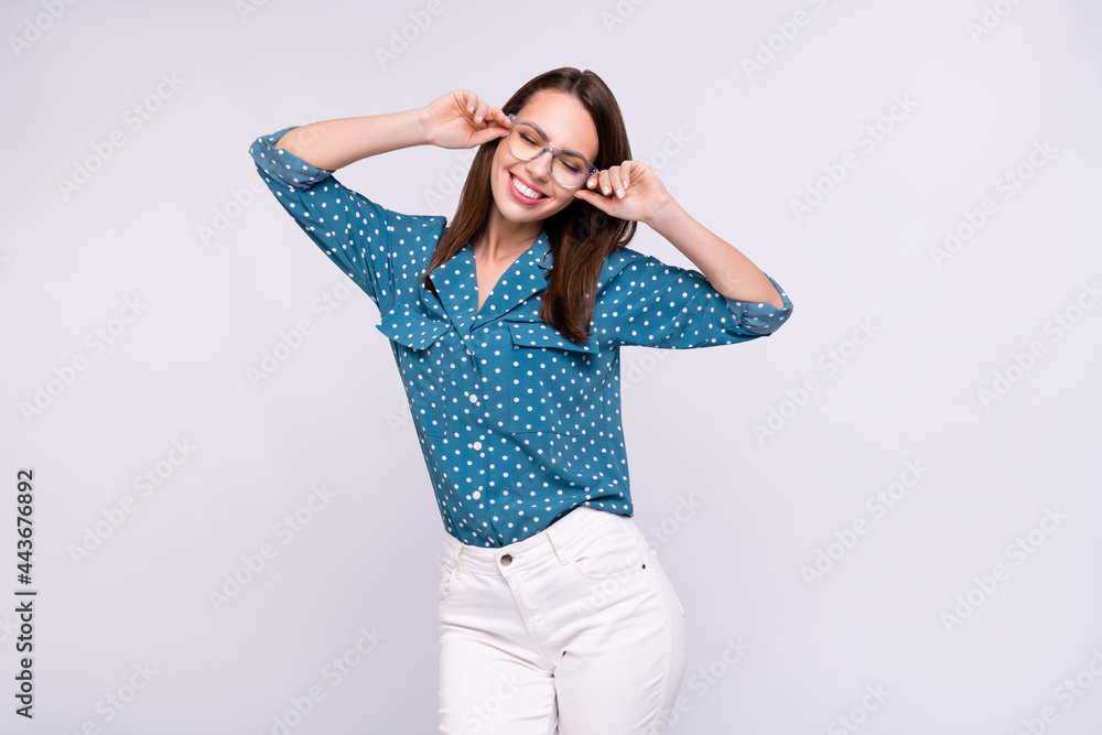 Photo of funny brunette hair boss lady wear eyewear blue shirt isolated on grey color background Photo of funny brunette hair boss lady wear eyewear blue shirt isolated on grey color background