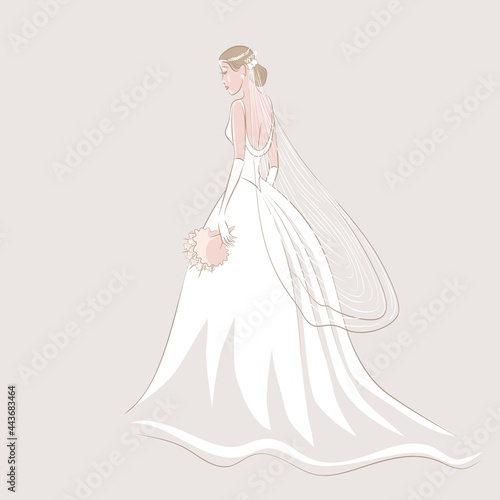 Bride in wedding dress and veil with bouquet