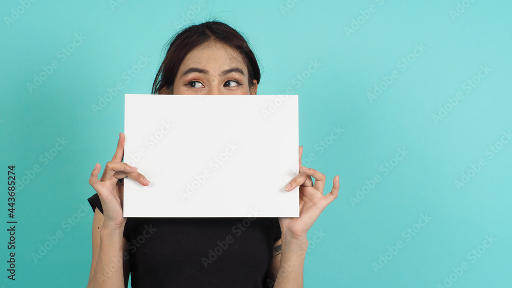Woman hands is holding empty board on black background.Blank white A4 paper. Woman hands is holding empty board on black background.Blank white A4 paper.