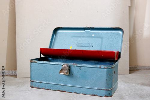 old metal suitcase with tool handle