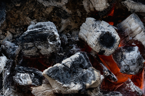 Photos Burning charcoals top view. Birch charcoal for barbecue