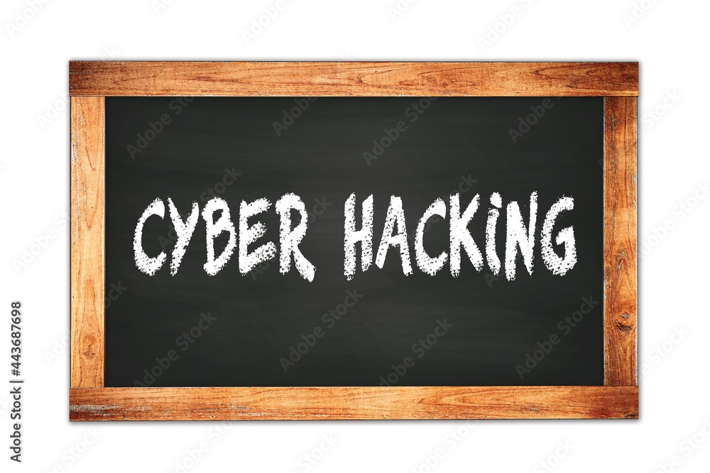 Fototapeta premium CYBER HACKING text written on wooden frame school blackboard.
