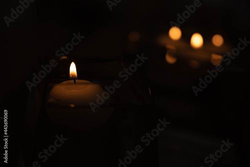 THE LIGHT OF A CANDLE IN THE DARK