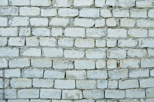 An old vintage wall made of white brick.