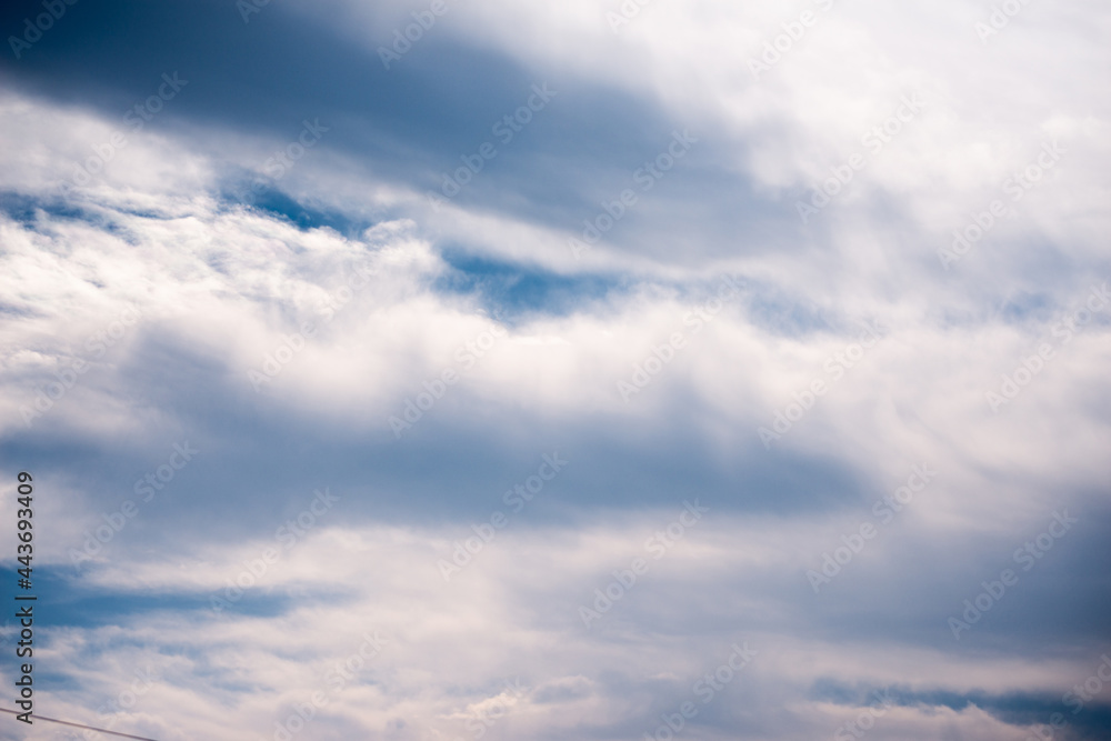 Scattered cloud clusters in a blue sky, blue sky background with white clouds, Scattered cloud clusters in a blue sky, blue sky background with white clouds,