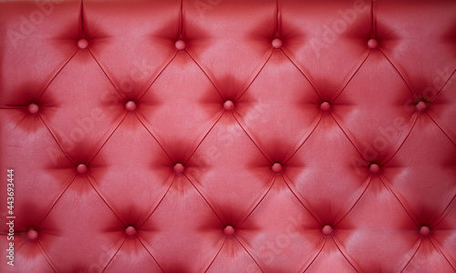 The texture of the material is red genuine leather