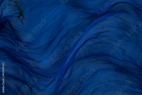 abstract blue background with waves of fabric