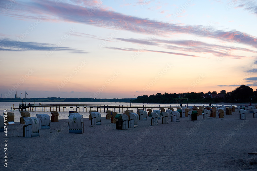 beautiful sunset on the white baltic sea beach beautiful sunset on the white baltic sea beach