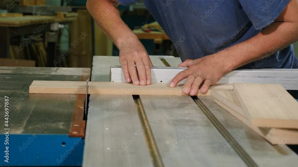 Process of making wood chipboard furniture. Cutting boards. man makes furniture at factory, Cutting wood with electric saw. electric circular machine. fine wood dust flies, 4 k video Process of making wood chipboard furniture. Cutting boards. man makes furniture at factory, Cutting wood with electric saw. electric circular machine. fine wood dust flies, 4 k video