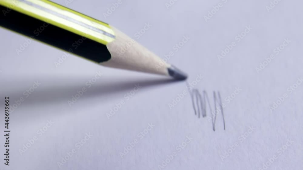 Artist drawing a line with a pencil. Artists hands drawing wooden pencil writes line on paper. Art concept. Close up, macro Artist drawing a line with a pencil. Artists hands drawing wooden pencil writes line on paper. Art concept. Close up, macro