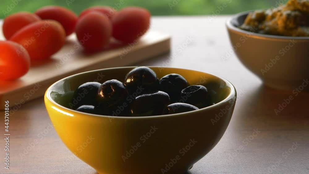 Black olives with ingredients in the kitchen Black olives with ingredients in the kitchen