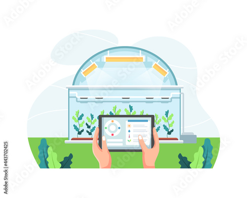 Farmer holding tablet managing farm in a greenhouse