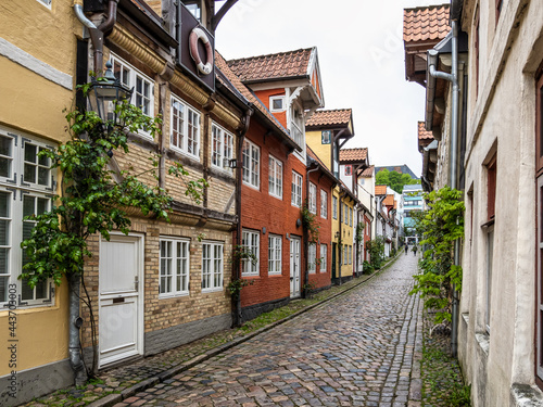 Colorful half timbered living houses in a row along the Oluf Samson street in old town of Flensburg  Germany