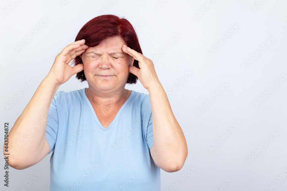 Migraine pain mature woman isolated on white background. healthcare and medicine concept.
Migraine pain mature woman isolated on white background. healthcare and medicine concept.