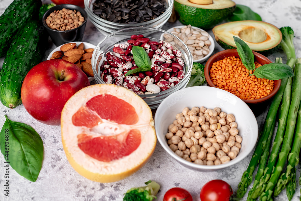 Fresh fruits, vegetables and seeds. Healthy food on a light stone background. Fresh fruits, vegetables and seeds. Healthy food on a light stone background.