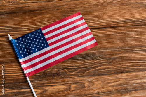 top view of small american flag on wooden table
