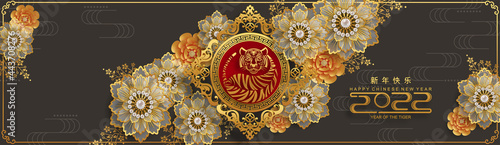 Chinese new year 2022 year of the tiger red and gold flower and asian elements paper cut with craft style on background.( translation : chinese new year 2022, year of tiger )